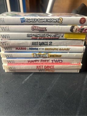 9 total Stack of Nintendo Wii Games with Cases - Assorted Titles